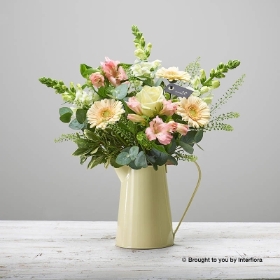 Florist choice flowers arranged in zinc jug